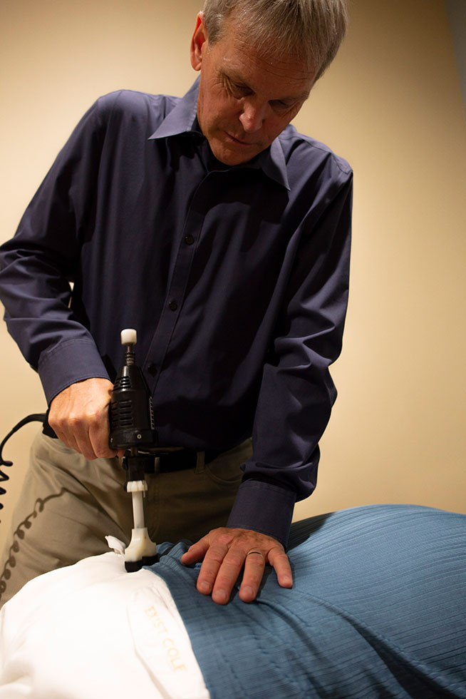 dr eric larson chiropractor fixing back pain